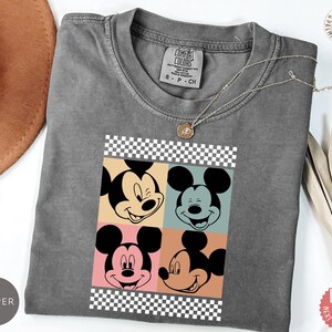 Peut inclure: Ensemble de trois tasses en c&eacute;ramique avec une finition mate et mouchet&eacute;e. Les tasses sont de couleurs cr&egrave;me, gris clair et gris fonc&eacute;. Chaque tasse a un design simple et minimaliste.