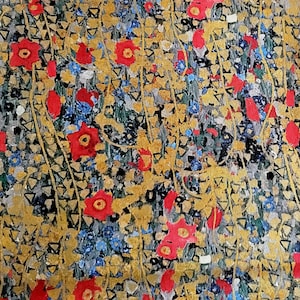 May include: A close-up of a colorful floral pattern with red, yellow, and blue flowers on a gold background. The pattern is reminiscent of a vintage textile or wallpaper.