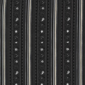 May include: A fabric with a repeating vertical stripe pattern. The stripes alternate between black, off-white, and gray. The black stripes feature a floral and dotted design. The fabric is likely used for clothing or home decor.