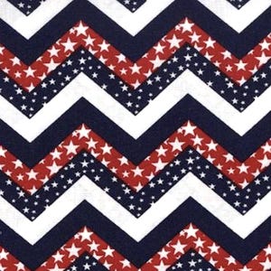 May include: Red, white, and blue chevron pattern fabric with white stars on a navy blue background. The fabric has a repeating pattern of red and white stars on a navy blue background.