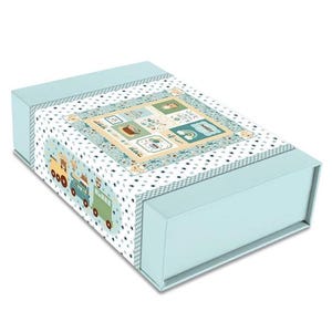 May include: A rectangular, light blue box with a decorative lid. The lid features a patterned design with a train, bears, and various illustrated squares. The box is designed with a light blue base and a patterned border.