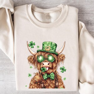 Lucky Highland Cow St. Patrick&#39;s Day Shirt, Shamrock Cow Sweatshirt, Cute Irish Cow Shirt, St. Paddy’s Day Gift, Green Cow St. Patrick’s Tee