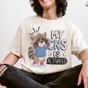 My CNS Is Activated T-Shirt, Funny Medical Gift For Nurse, Doctor, Healthcare Workers, Neurologist, Cute Raccoon Tee, Gift for Animal Lovers