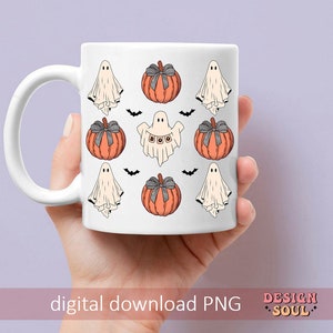 May include: White ceramic mug featuring a Halloween-themed design. The design includes orange pumpkins with gray bows, white ghosts, and black bats. The mug has the text "digital download PNG".