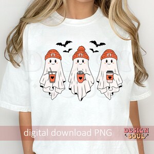 May include: White t-shirt featuring three cartoon ghosts wearing orange beanies and holding beverages. The ghosts have smiling faces and are accompanied by black bat silhouettes. The text "digital download PNG" is visible.