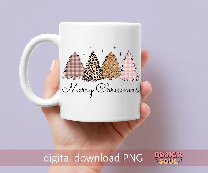 May include: White ceramic mug with a pink, brown, and gold Christmas tree design and the text "Merry Christmas".