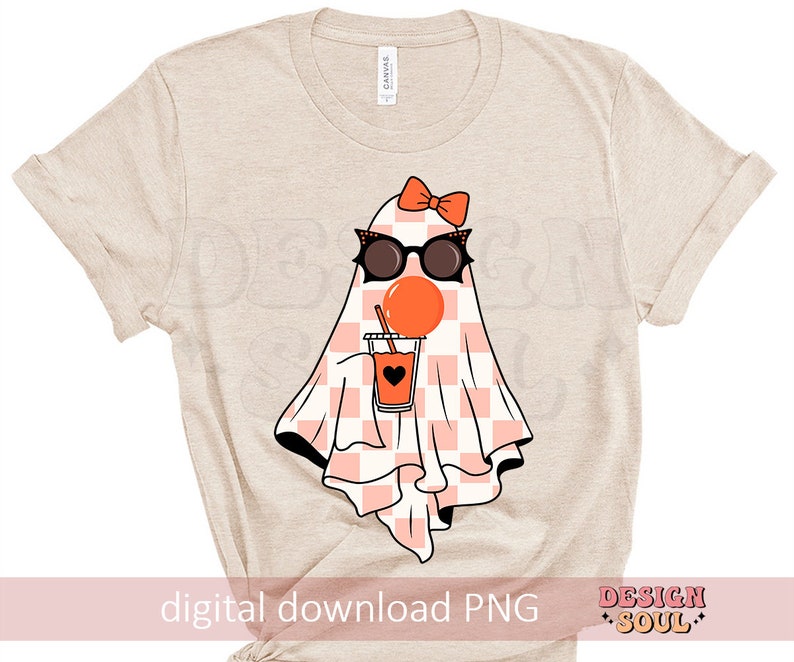 May include: A beige t-shirt with a graphic of a ghost wearing sunglasses and holding a cup of orange juice. The ghost has a pink bow on its head and a checkered pattern on its body. The text "digital download PNG" is at the bottom of the shirt.