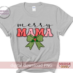 May include: A gray t-shirt with the text "merry mama" in red and pink letters with white polka dots. A green bow with red berries and green leaves is below the text.