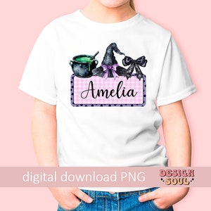 May include: A white t-shirt with a pink and white checkered design with black polka dots. The design features a witch's hat, a cauldron, and the name "Amelia".