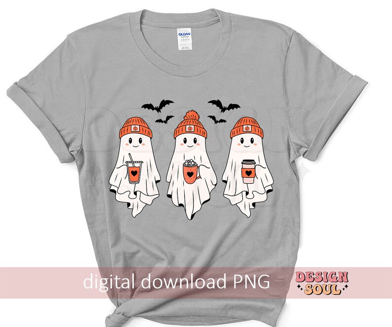 May include: A light gray t-shirt featuring three cartoon ghosts wearing orange pumpkin beanies and holding fall-themed beverages. Black bats fly above the ghosts. The text "digital download PNG" is at the bottom.