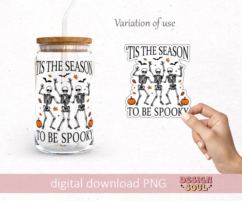 May include: A digital download of a graphic design featuring three skeletons dancing with the text "Tis the season to be spooky" and pumpkins. The design is shown on a clear glass jar with a wooden lid and a straw.