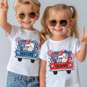 May include: Two children wearing white t-shirts with patriotic designs. The shirts feature a red or blue truck graphic with an American flag, stars, and the names "AXTON" and "OLIVIA". Both children are wearing sunglasses and making peace signs.