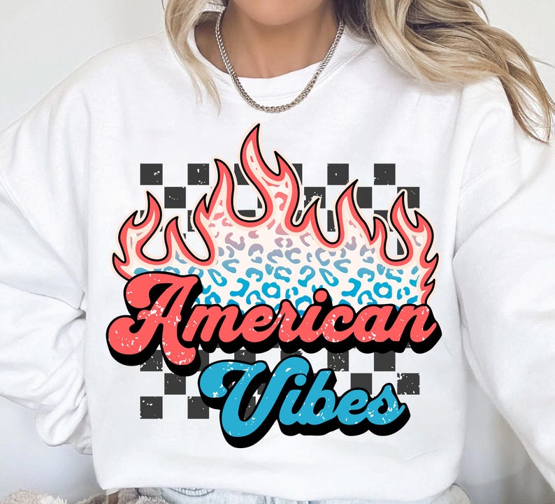 May include: White sweatshirt with a graphic of a flame with a leopard print design. The text "American Vibes" is in a retro font.