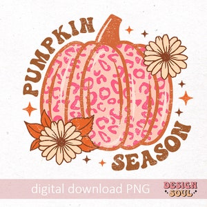 May include: A retro-style graphic design featuring a pink and orange pumpkin with a leopard print pattern. The pumpkin is surrounded by flowers and the text "Pumpkin Season".