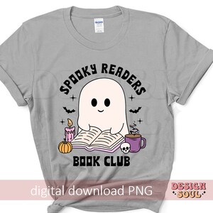 May include: A gray t-shirt with a ghost reading a book. The text on the shirt says "Spooky Readers Book Club".