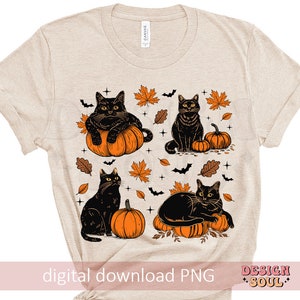 May include: Beige t-shirt featuring a graphic design of four black cats with orange pumpkins, autumn leaves, and bats. The words "digital download PNG" and "DESIGN SOUL" are printed on the shirt.