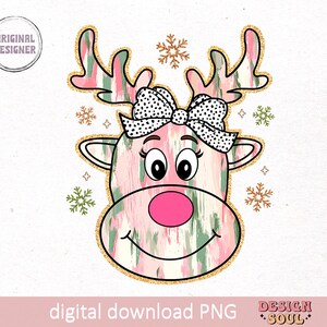 May include: A pink and green reindeer with a black and white polka dot bow. The reindeer has a pink nose and gold glitter accents. The background is white with snowflakes.