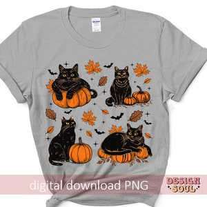 May include: A light gray t-shirt featuring a Halloween design. The design includes four black cats, orange pumpkins, autumn leaves, and bats. The words "digital download PNG" and "DESIGN SOUL" are also visible.
