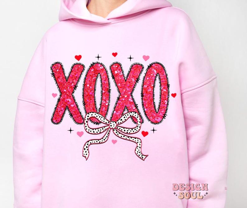May include: Pink hoodie with a sparkly pink and black "XOXO" design with a black and white polka dot bow.