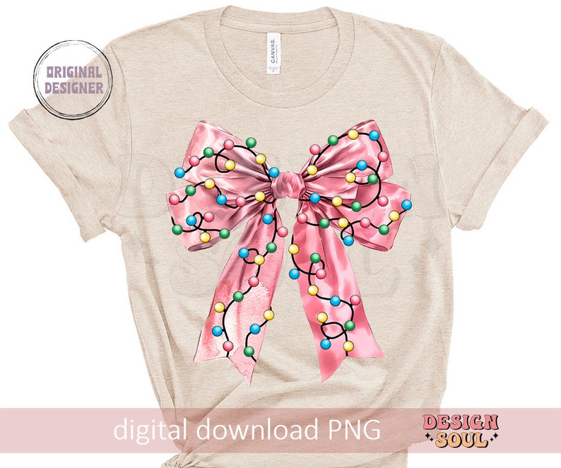 May include: A beige t-shirt with a pink bow with colorful lights on it. The bow is centered on the shirt. The text "digital download PNG" is at the bottom of the shirt.