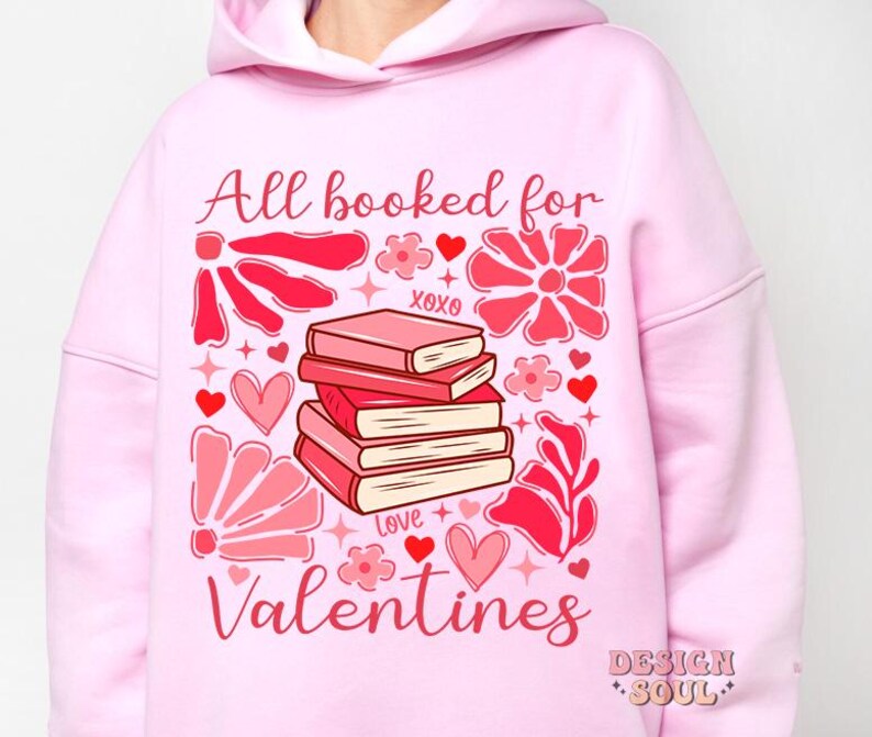 May include: Pink hoodie with a graphic design of a stack of books, hearts, flowers, and the text "All booked for Valentines".
