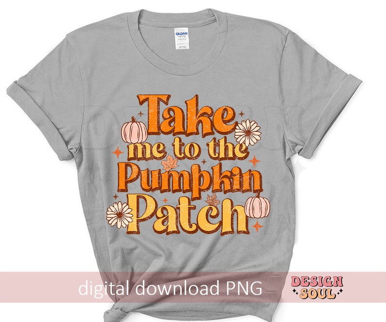 May include: A gray t-shirt with the text "Take me to the Pumpkin Patch" in orange and brown lettering. The text is surrounded by small orange pumpkins, brown leaves, and orange flowers.
