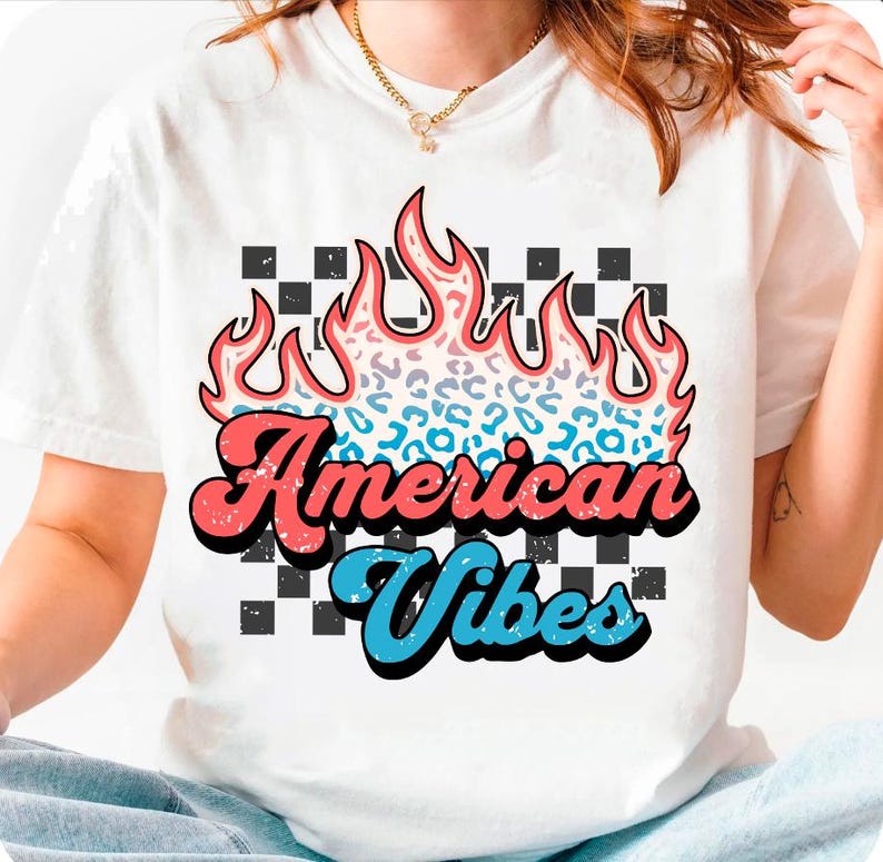 May include: White t-shirt with a graphic of a flame with a leopard print design. The text "American Vibes" is in a retro font.