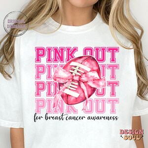 May include: White t-shirt with a pink ribbon and football design. The text "PINK OUT" is repeated four times and the words "for breast cancer awareness" are printed below the design.