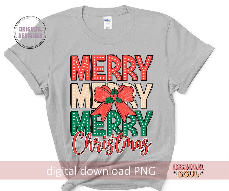 May include: A gray t-shirt with the text "Merry Merry Christmas" in red, green, and white polka dots. The text is layered with a red bow with green leaves.