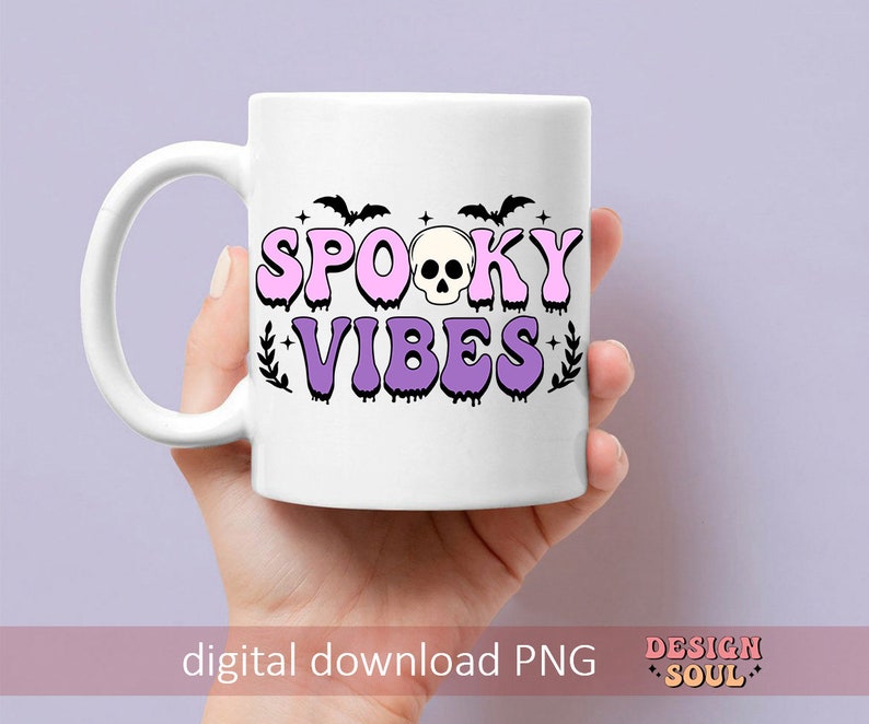 May include: White ceramic mug with a pink and purple design that says "Spooky Vibes" with a skull and bats.
