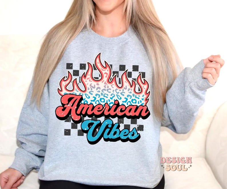 May include: A gray sweatshirt with a graphic of a red, blue, and white flame with a leopard print design. The text "American Vibes" is written in a retro font.