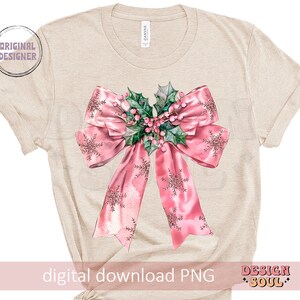 May include: A beige t-shirt with a pink bow and green holly sprig design. The bow has a sparkly, snowflake-like pattern. The text "digital download PNG" is at the bottom of the shirt.