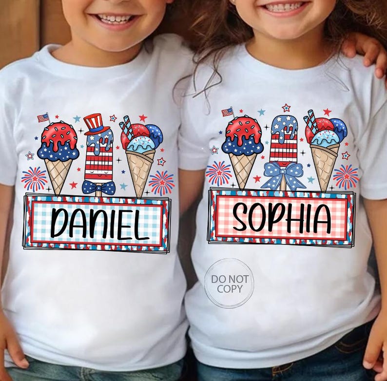 May include: White t-shirts with patriotic ice cream cone and popsicle designs. Each shirt features a name, "DANIEL" and "SOPHIA", in a red and blue plaid frame, with fireworks and stars.