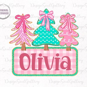 May include: A digital design featuring three Christmas trees with pink bows and gold accents. The trees sit above a pink and white plaid sign that reads "Olivia". The design has a "Original Designer" logo.