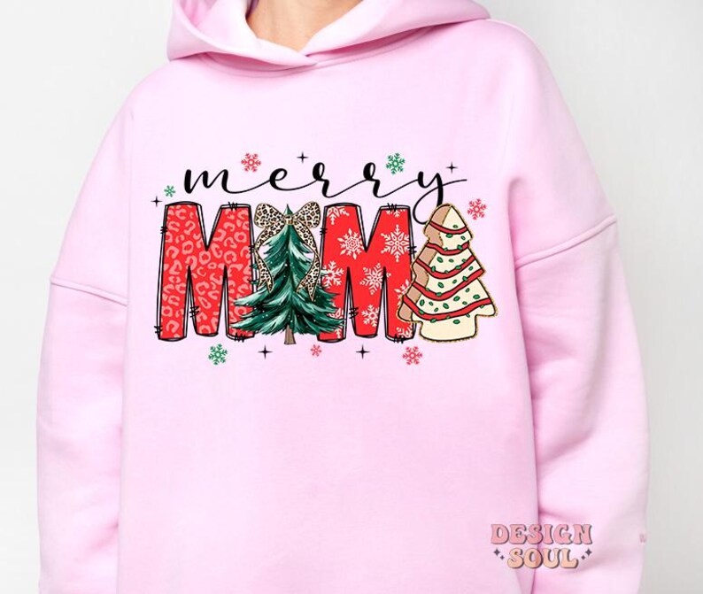 May include: Pink hoodie with a Christmas design that says "merry mama" with a red, green, and white color scheme. The design features a Christmas tree with a bow and snowflakes.