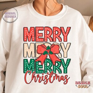 May include: White sweatshirt with a red, white, and green graphic that says "Merry Merry Merry Christmas" with a red bow and green holly.