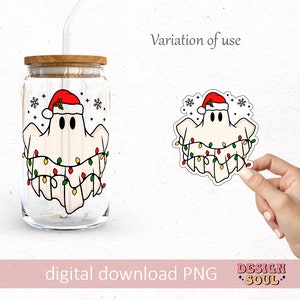 May include: A clear glass jar with a wooden lid and a straw. The jar has a Christmas ghost design with a red Santa hat, white ghost, and colorful lights. The design is also available as a sticker.