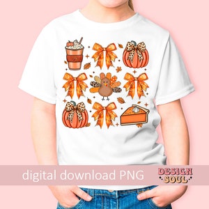 May include: A white t-shirt with a digital print of fall-themed images, including pumpkins, a turkey, a pie, and a coffee cup. The images are surrounded by fall-colored bows and leaves. The text "digital download PNG" is at the bottom of the shirt.
