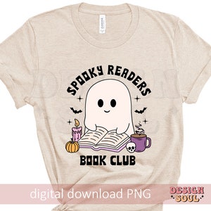 May include: A beige t-shirt with a spooky reader book club design. The design features a ghost reading a book, a pumpkin, a candle, and a cup of coffee. The text "Spooky Readers Book Club" is in black.