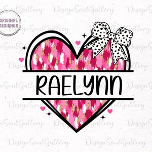 May include: A pink and gold heart with a black outline and a black and white polka dot bow on top. The name "RAELYNN" is written in black letters below the heart.