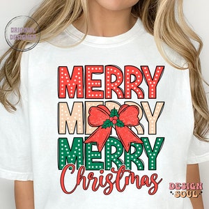 May include: White t-shirt with a red, white, and green graphic that says "Merry Merry Merry Christmas". The graphic features a red bow with green leaves and a red berry.