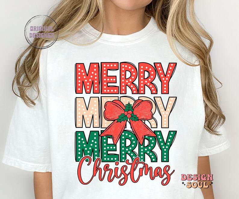 May include: White t-shirt with a red, white, and green graphic that says "Merry Merry Merry Christmas". The graphic features a red bow with green leaves and a red berry.