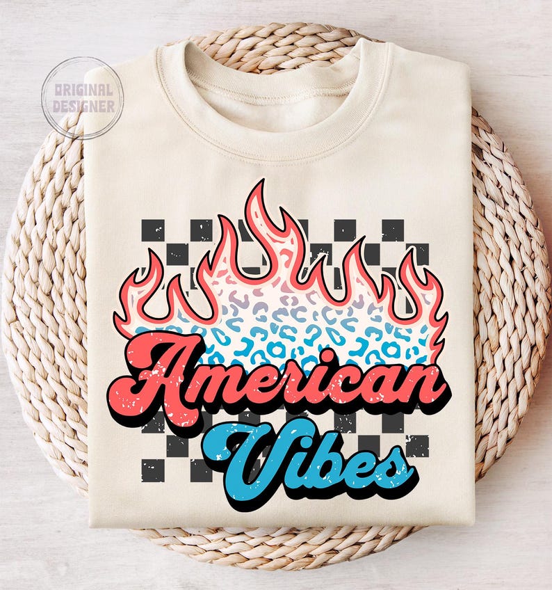 May include: A cream-colored sweatshirt with a graphic design of a flame with a leopard print pattern. The text "American Vibes" is in a retro font with red and blue accents. The background is a black and white checkered pattern.