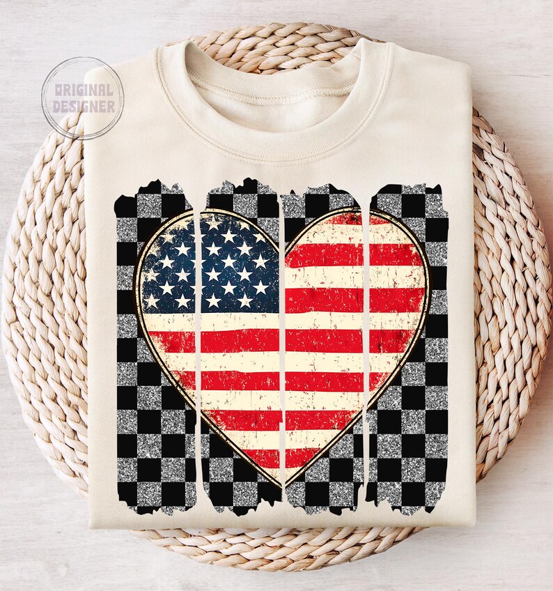 May include: A cream-colored sweatshirt with a distressed, glittery checkered background and a heart-shaped American flag design.