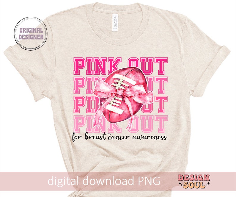 May include: A beige t-shirt with a pink football with a pink ribbon around it. The text "PINK OUT for breast cancer awareness" is printed on the shirt.