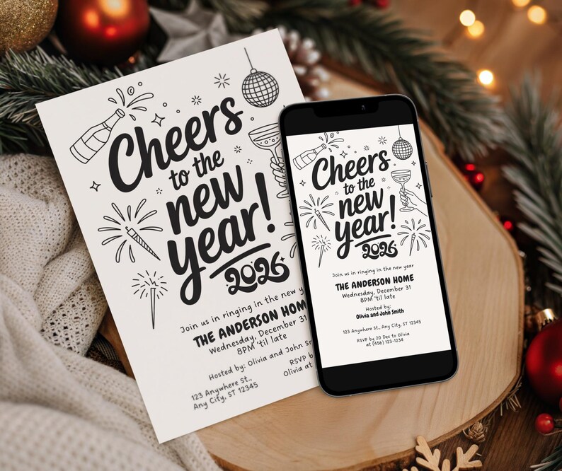 May include: A black smartphone and a white invitation card with the text "Cheers to the new year! 2026". The invitation includes fireworks, champagne bottles, and a disco ball illustration. The phone displays the same design.