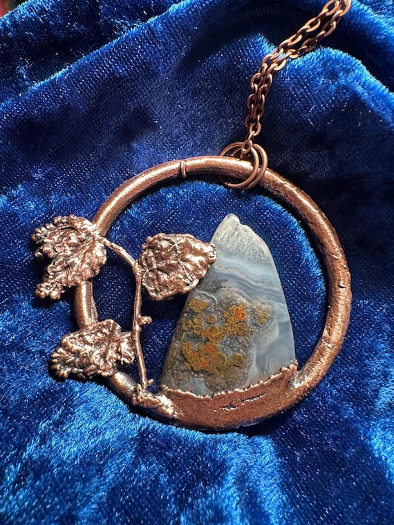 Reversible moss agate stone set inside an electroformed copper mountain — two looks in one, with a real semi-precious stone as the centerpiece.