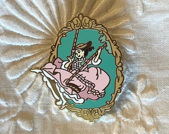 El pin rococó del columpio