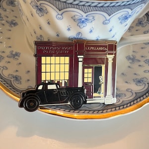 A. Z. FELL & Co Az's bookshop Angel and Demon enamel pin