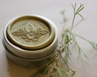 Impromptu™ Solid Natural Perfume in a Round Tin  - A plant fragrance featuring lemongrass with notes of leather, wood and herb  Nature Girl